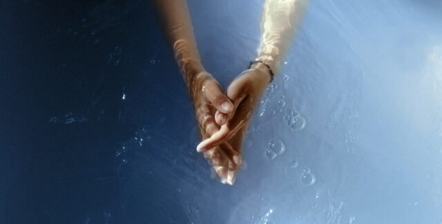 hands together in water