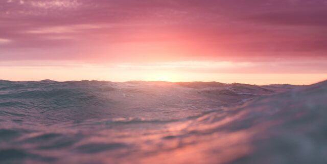 picture of sunset over ocean waves