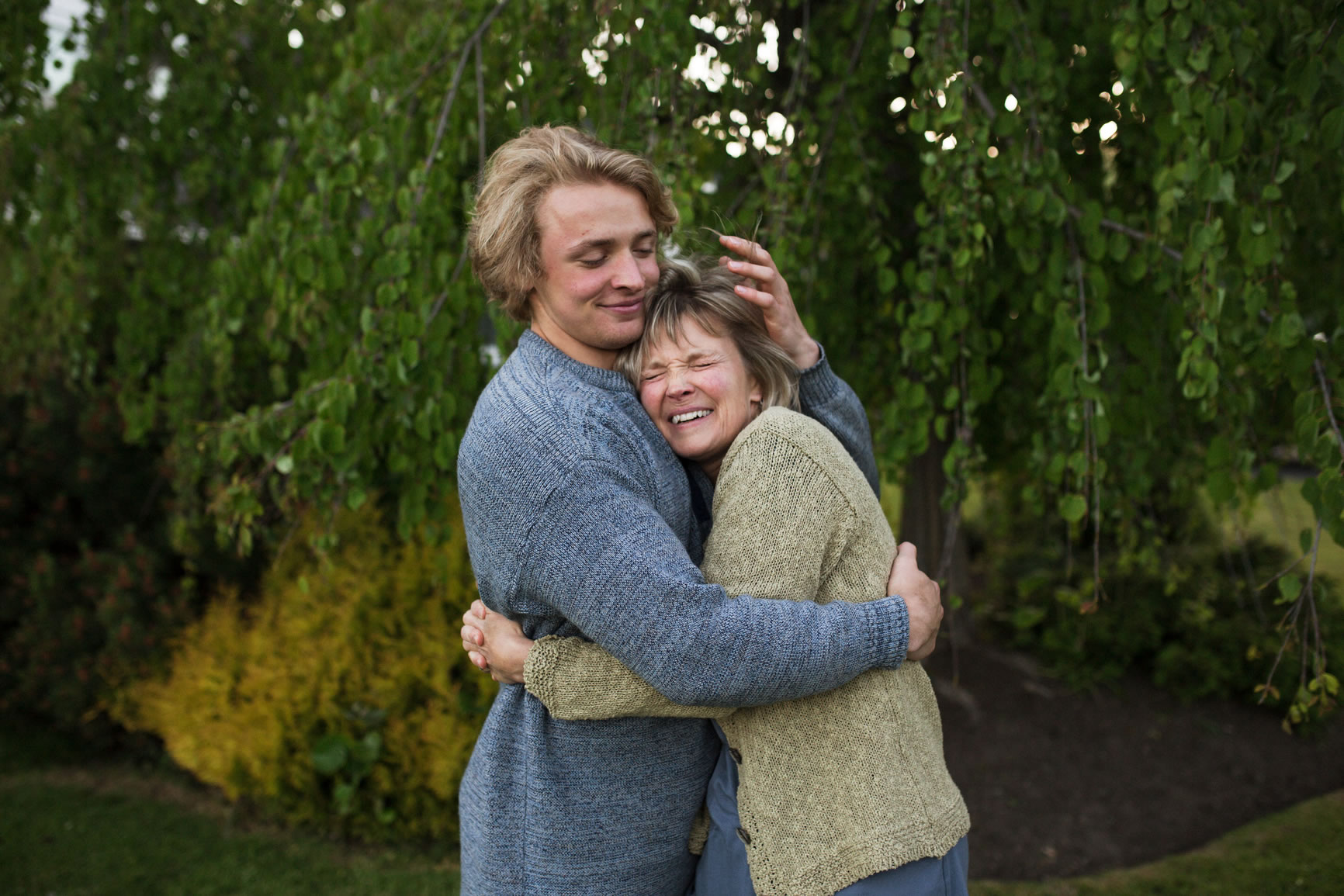 mom and son hugging